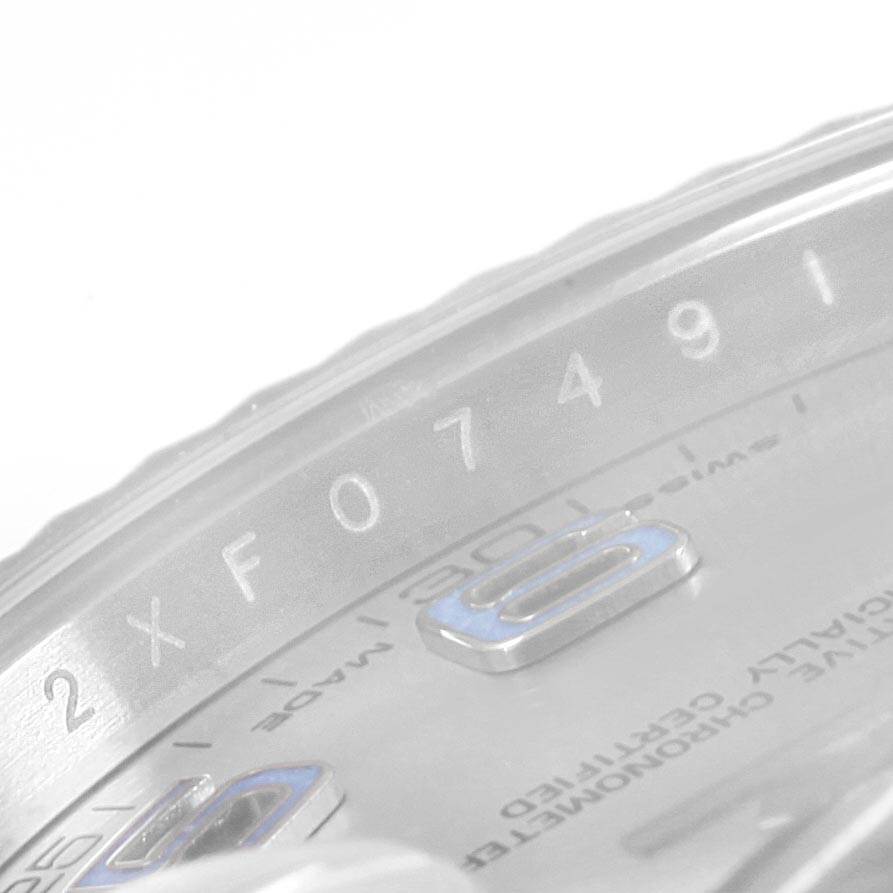 This close-up shows part of the dial and bezel with engraved details of the Rolex Datejust 41 116334 Men's Stainless Steel Grey Dial 116334 Men's Stainless Steel Grey Dial model.