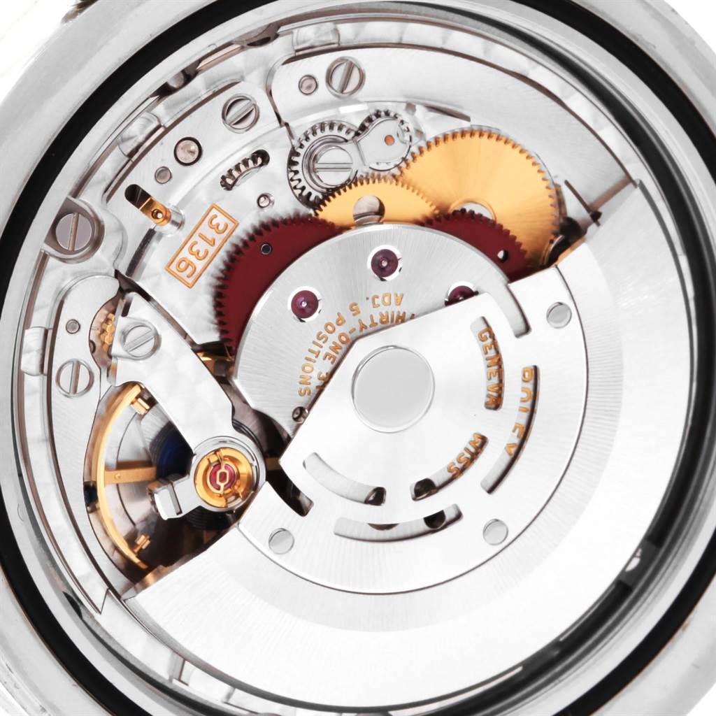 The image shows a close-up view of the movement inside a Rolex Datejust 41 116334 Men's Stainless Steel Grey Dial 116334 Men's Stainless Steel Grey Dial watch, highlighting gears and mechanisms.