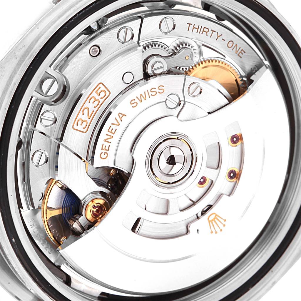 This is a close-up of the movement mechanism inside a Rolex Datejust 41 126300 Men's Stainless Steel Black Dial 126300 Men's Stainless Steel Black Dial, showcasing gears and the oscillating weight.