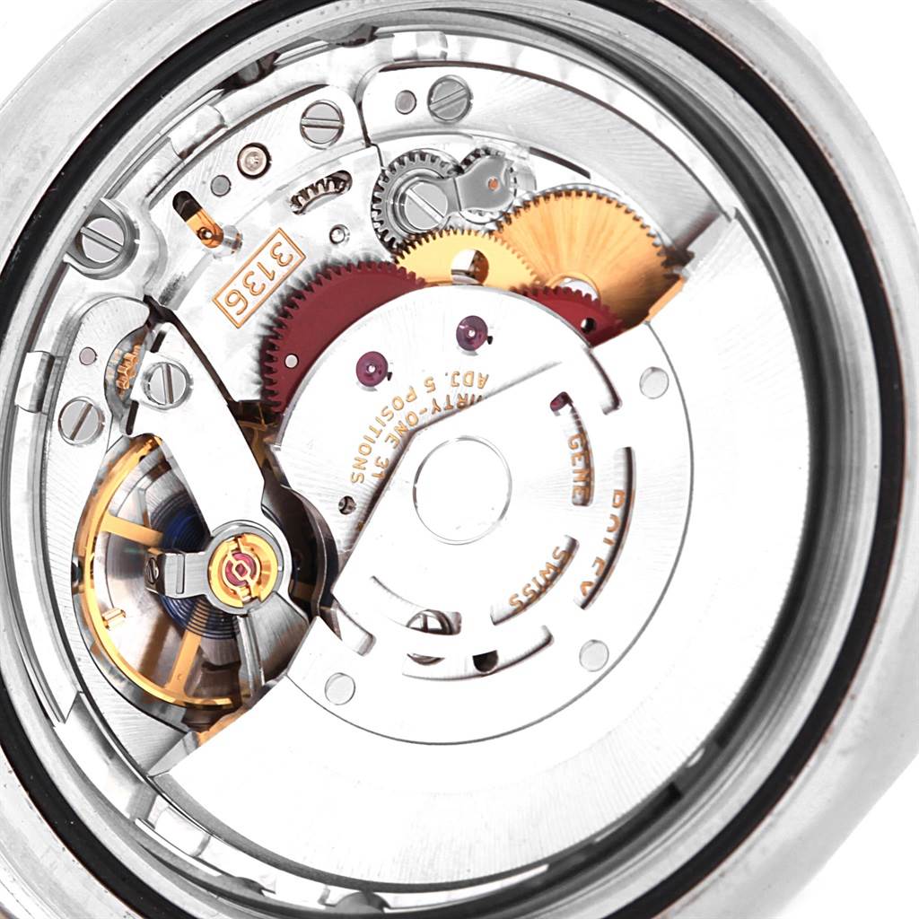 The close-up image shows the intricate mechanical movement of a Rolex Datejust 41 116334 Men's Stainless Steel Blue Dial 116334 Men's Stainless Steel Blue Dial watch.