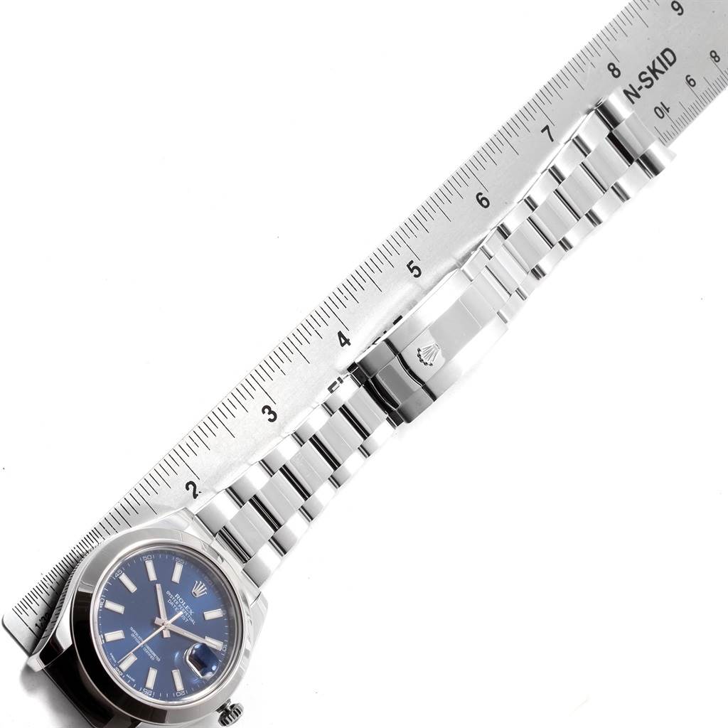 The image shows a Rolex Datejust 41 116300 Men's Stainless Steel Blue Dial 116300 Men's Stainless Steel Blue Dial watch angled diagonally with its strap measured against a ruler.
