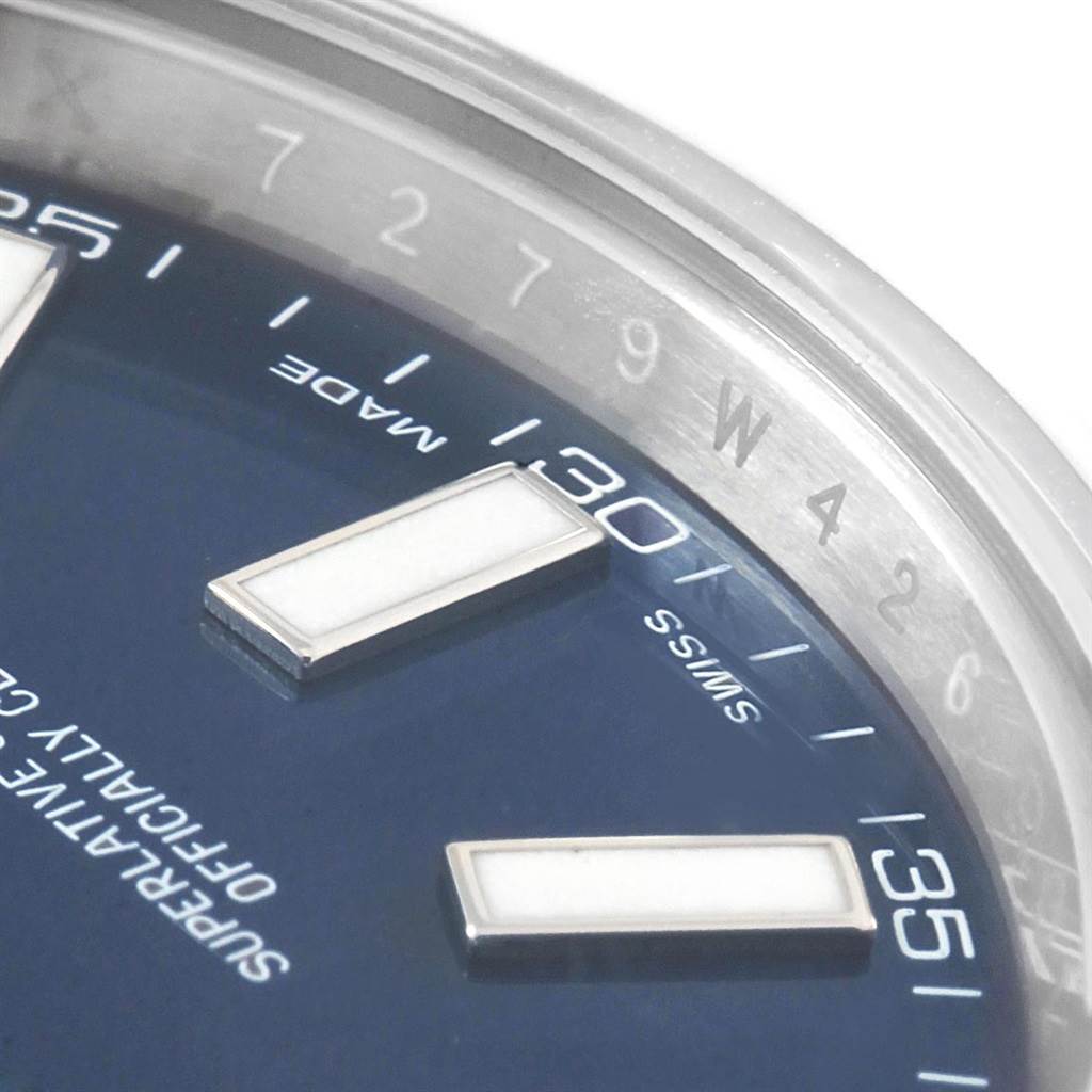 This close-up angle of the Rolex Datejust 41 116300 Men's Stainless Steel Blue Dial 116300 Men's Stainless Steel Blue Dial watch shows part of the dial and the edge of the bezel.