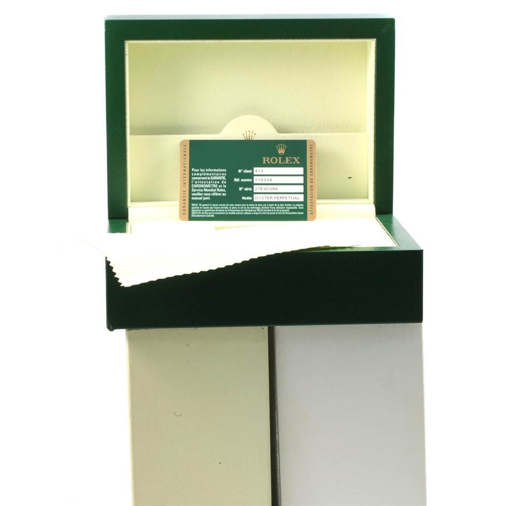 The image shows the inside of a Rolex Datejust 41 116334 Men's Stainless Steel Grey Dial 116334 Men's Stainless Steel Grey Dial watch box with a warranty card displayed inside.