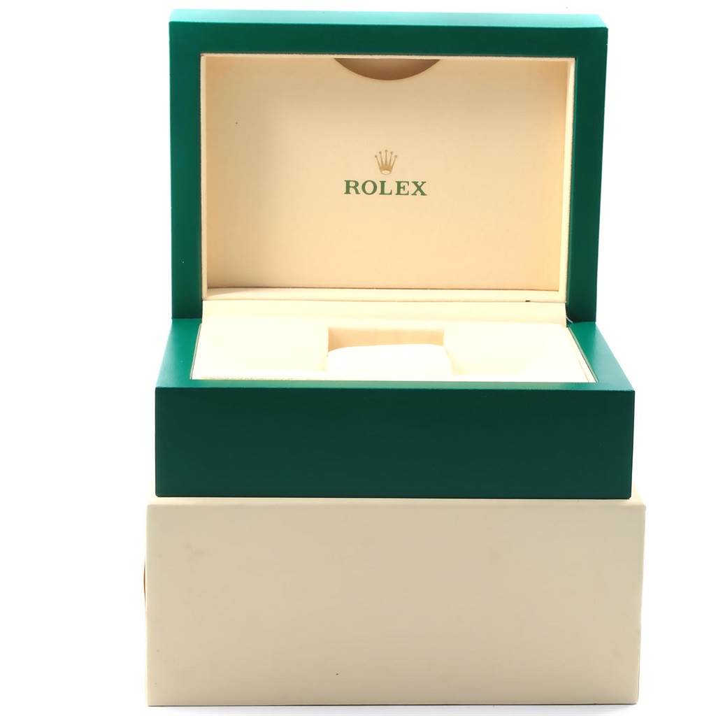The image shows an open green and beige box for the Rolex Datejust 41 126300 Men's Stainless Steel Blue Dial 126300 Men's Stainless Steel Blue Dial watch.