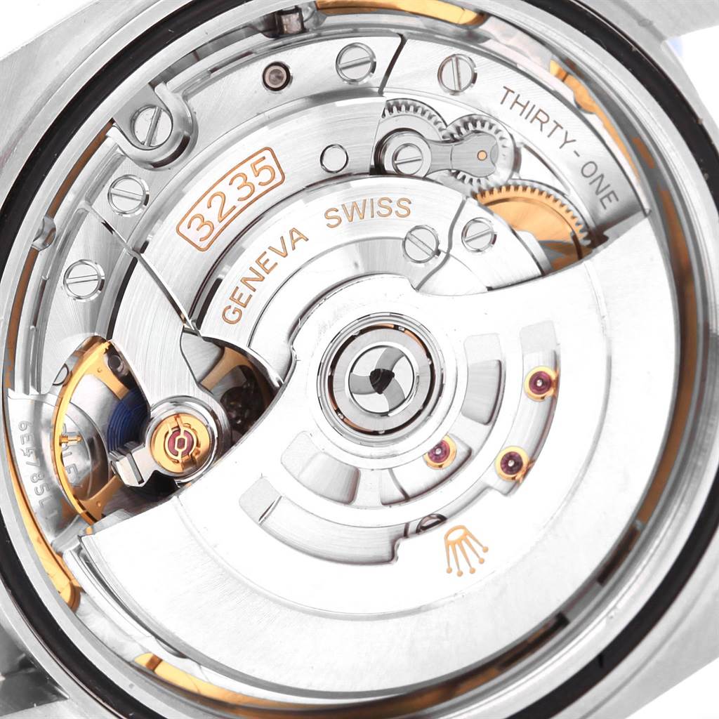 This image shows a close-up view of the movement mechanism of the Rolex Datejust 41 126300 Men's Stainless Steel Blue Dial 126300 Men's Stainless Steel Blue Dial, including gears and the rotor.