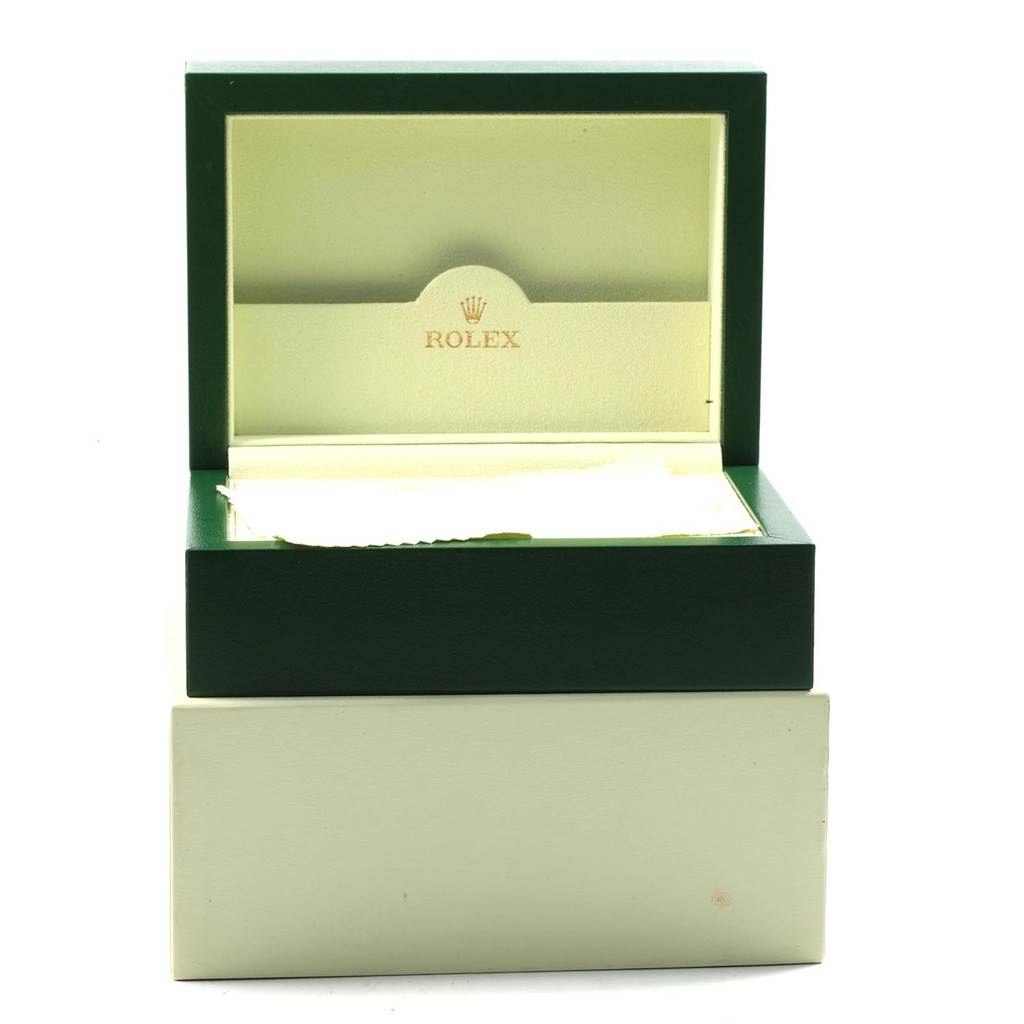 This is an open green Rolex Datejust 41 116300 Men's Stainless Steel Blue Dial 116300 Men's Stainless Steel Blue Dial watch box, revealing a beige interior with the Rolex logo.