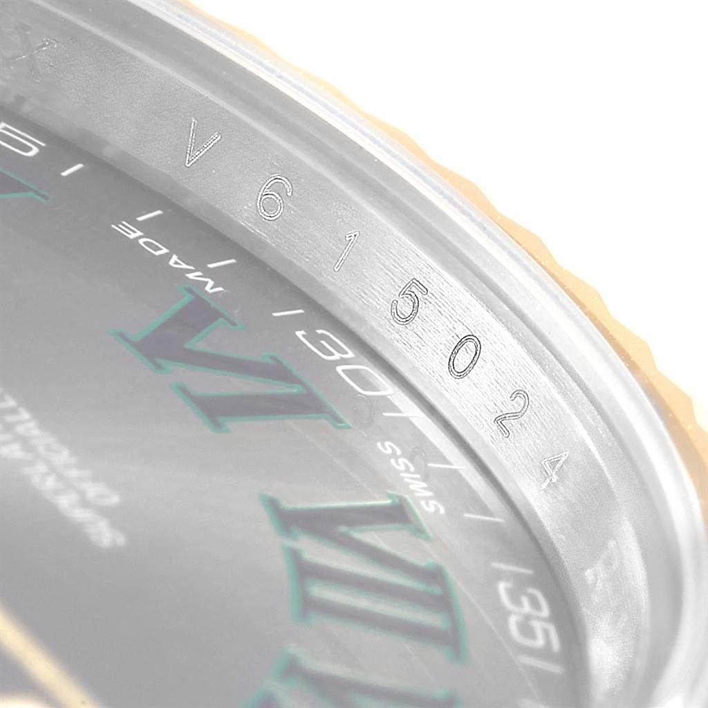 The image shows a close-up of the inner bezel and part of the dial of the Rolex Datejust 41 116333 Men's Steel and Gold (two tone) Grey Dial 116333 Men's Steel and Gold (two tone) Grey Dial, highlighting the engraved serial number.