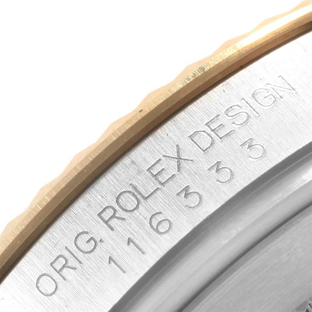 The image shows a close-up of the bezel and part of the caseback of the Rolex Datejust 41 116333 Men's Steel and Gold (two tone) Grey Dial 116333 Men's Steel and Gold (two tone) Grey Dial model, highlighting the branding and design text.