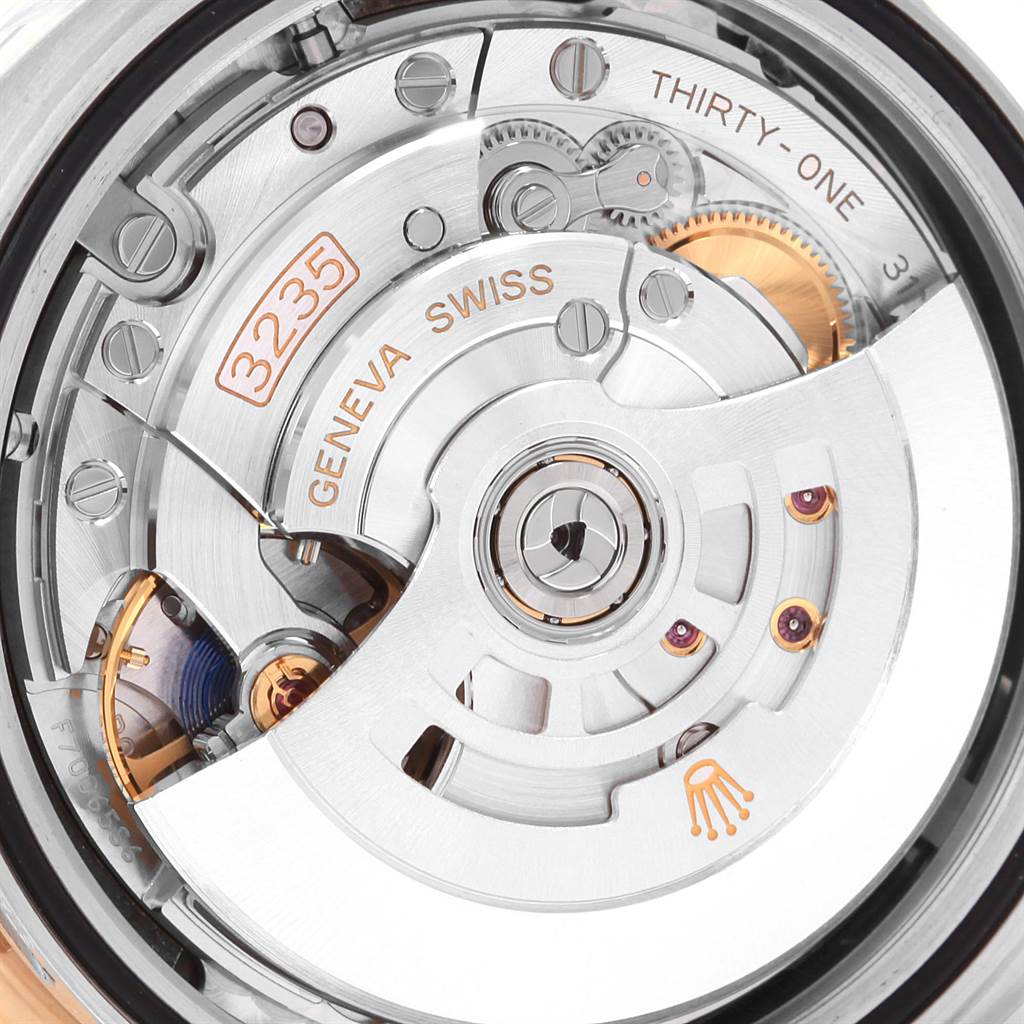 The image shows a close-up of the movement mechanism of a Rolex Datejust 41 126333 Men's Steel and Gold (two tone) Black Dial 126333 Men's Steel and Gold (two tone) Black Dial watch.