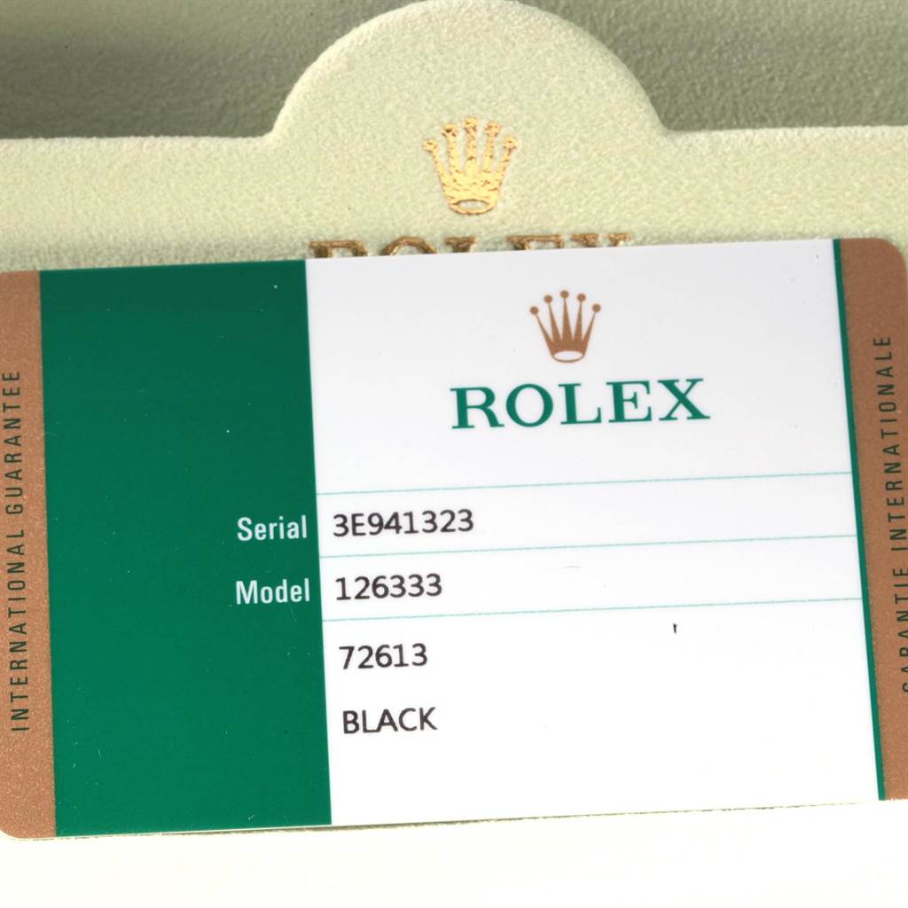 The image shows a guarantee card for a Rolex Datejust 41 126333 Men's Steel and Gold (two tone) Black Dial 126333 Men's Steel and Gold (two tone) Black Dial, model number 126333, with a partial view of the box.