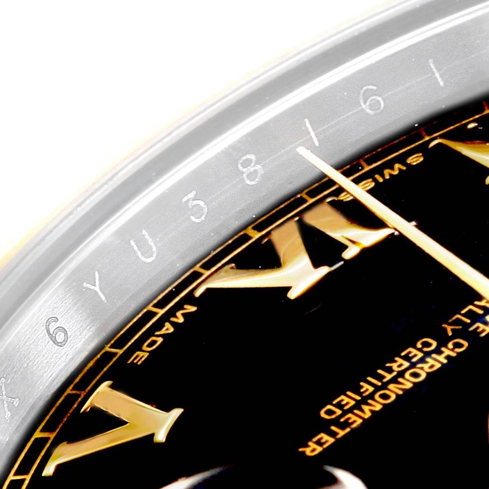 This image shows a close-up of the Rolex Datejust 41 116333 Men's Steel and Gold (two tone) Black Dial 116333 Men's Steel and Gold (two tone) Black Dial, focusing on the bezel and part of the dial with Roman numerals.