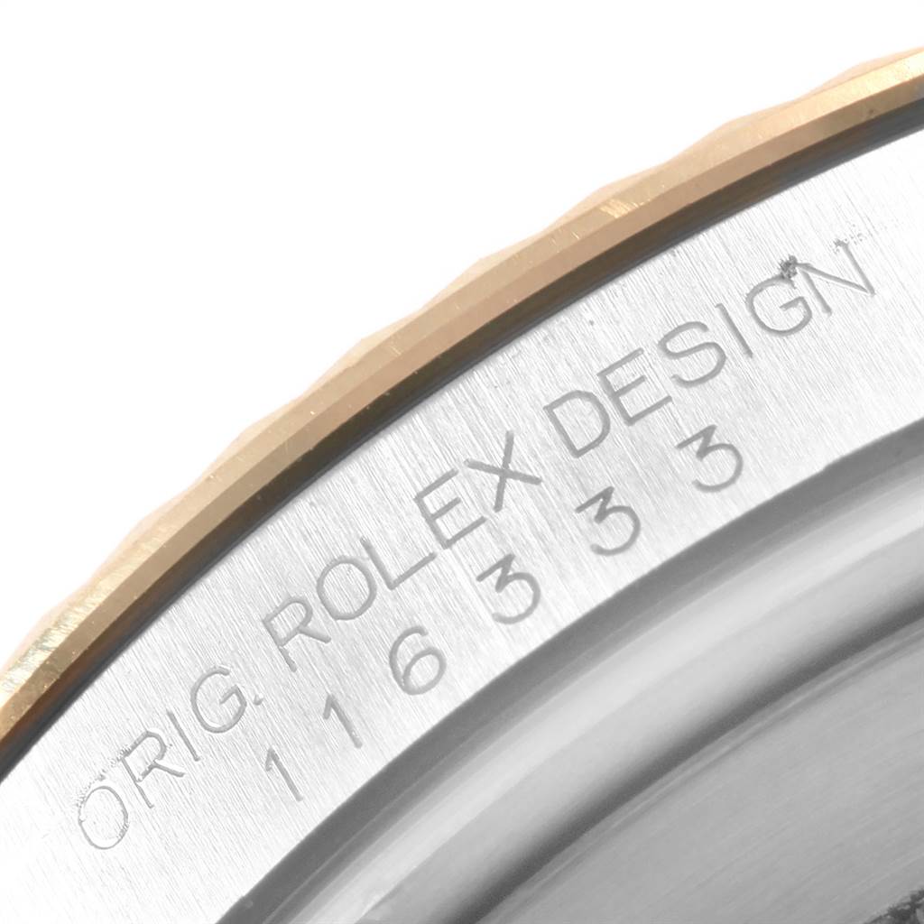 The image shows a close-up of the engraved serial number and branding on the bezel of a Rolex Datejust 41 116333 Men's Steel and Gold (two tone) Black Dial 116333 Men's Steel and Gold (two tone) Black Dial watch.