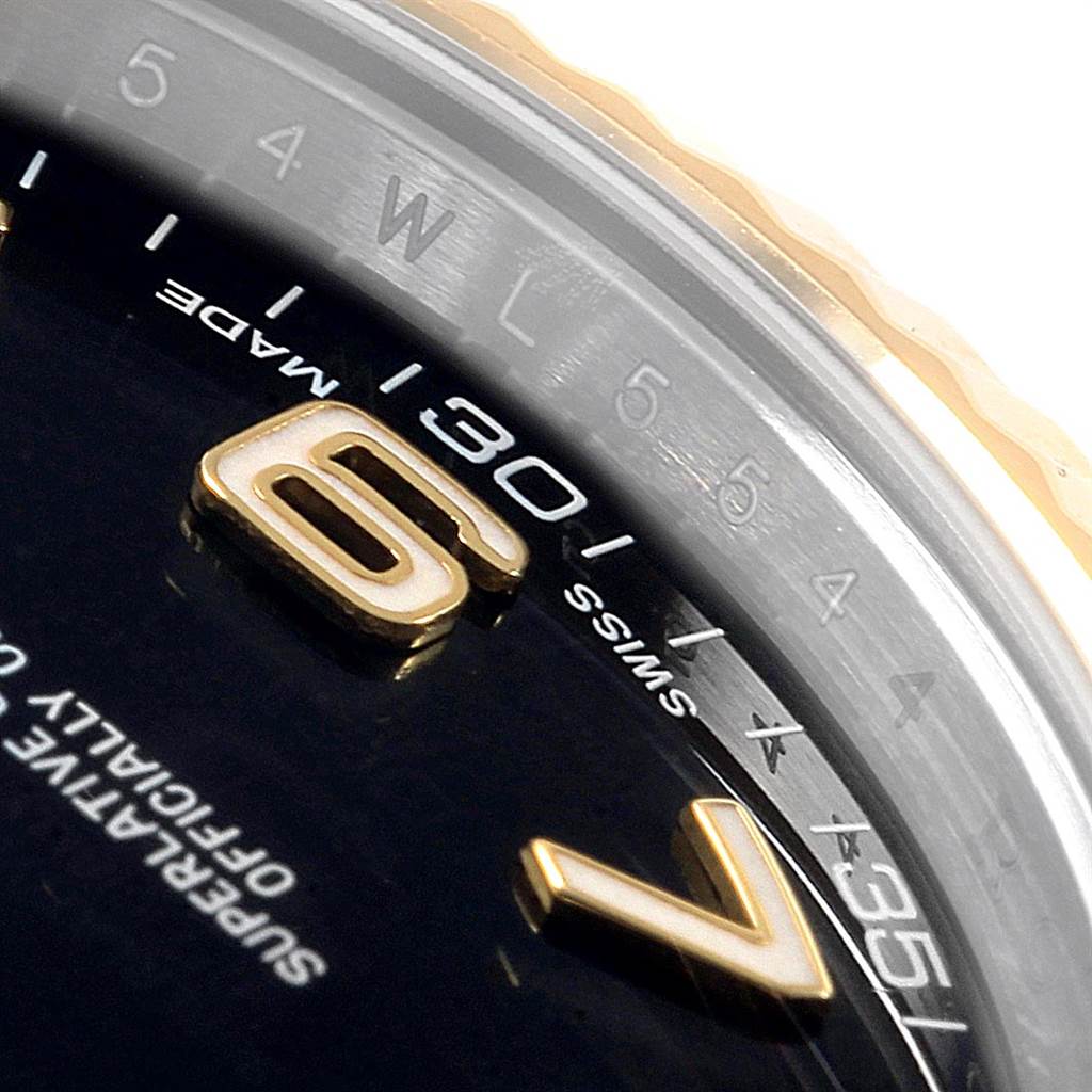 The image shows a close-up angle of the dial and bezel of the Rolex Datejust 41 116333 Men's Steel and Gold (two tone) Black Dial 116333 Men's Steel and Gold (two tone) Black Dial watch, highlighting the numerals and the "SWISS MADE" inscription.
