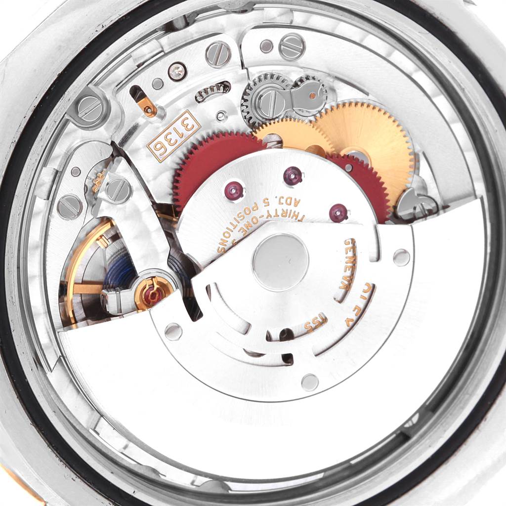 The image shows the intricate internal movement of the Rolex Datejust 41 116333 Men's Steel and Gold (two tone) Black Dial 116333 Men's Steel and Gold (two tone) Black Dial watch viewed from the back.