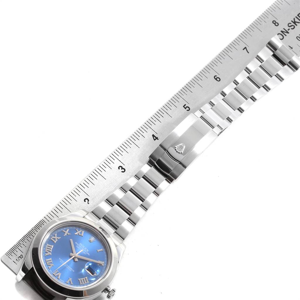 The image shows a Rolex Datejust 41 116300 Men's Stainless Steel Blue Dial 116300 Men's Stainless Steel Blue Dial model watch with its bracelet fully extended and a ruler measuring it.