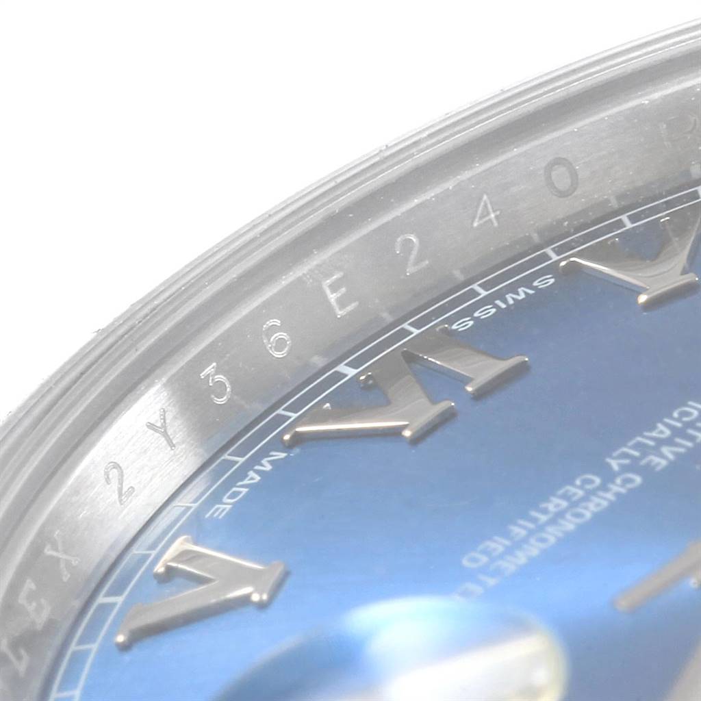 The image shows a close-up of the dial and surrounding bezel of the Rolex Datejust 41 116300 Men's Stainless Steel Blue Dial 116300 Men's Stainless Steel Blue Dial, highlighting Roman numerals and part of the serial number.