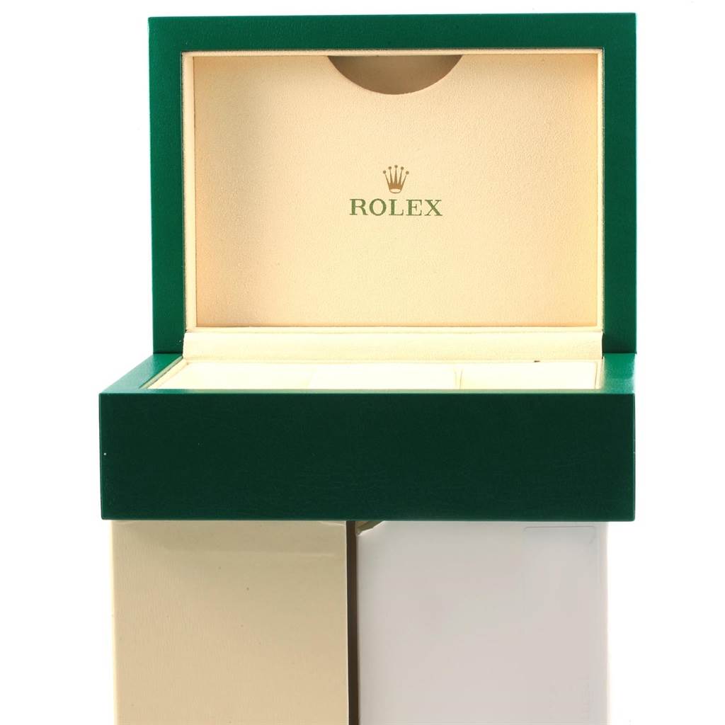 This image shows the open box for the Rolex Datejust 41 116300 Men
s Stainless Steel Blue Dial 116300 Men
s Stainless Steel Blue Dial model, with its green exterior and beige interior.