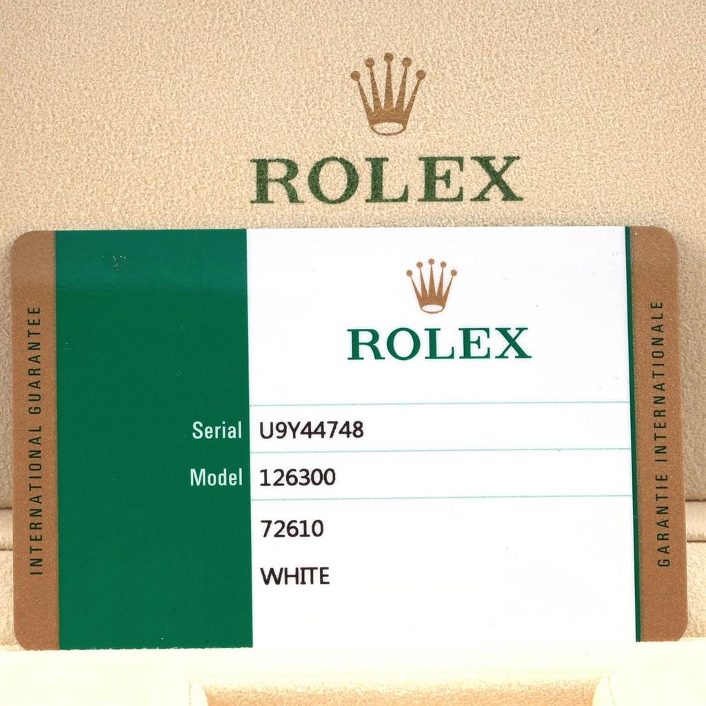 The image shows a guarantee card for the Rolex Datejust 41 126300 Men's Stainless Steel White Dial 126300 Men's Stainless Steel White Dial model, with the serial number and model details.