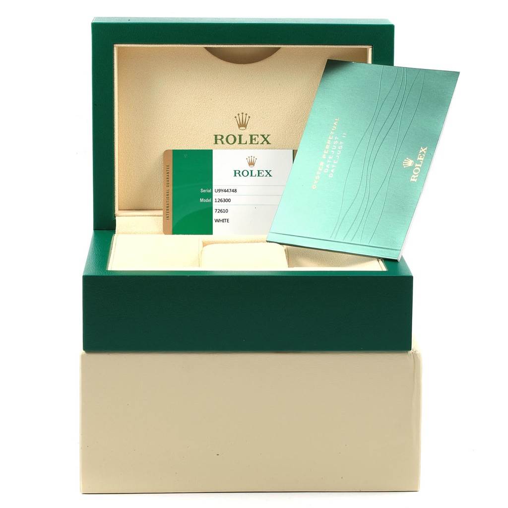 The image shows the open box of a Rolex Datejust 41 126300 Men's Stainless Steel White Dial 126300 Men's Stainless Steel White Dial model, including its authenticity card and documentation.