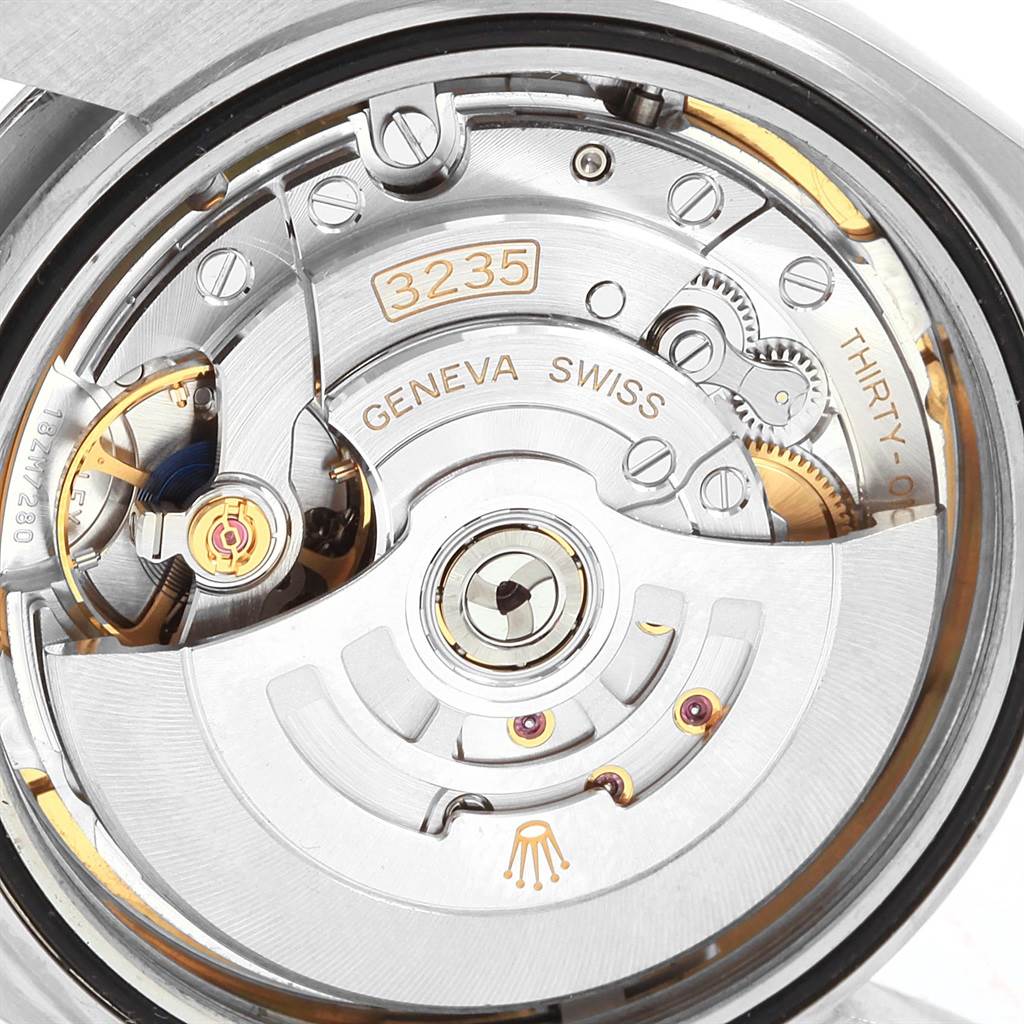 The image shows the intricate movement of a Rolex Datejust 41 126300 Men's Stainless Steel Blue Dial 126300 Men's Stainless Steel Blue Dial watch, highlighting its internal mechanical components.