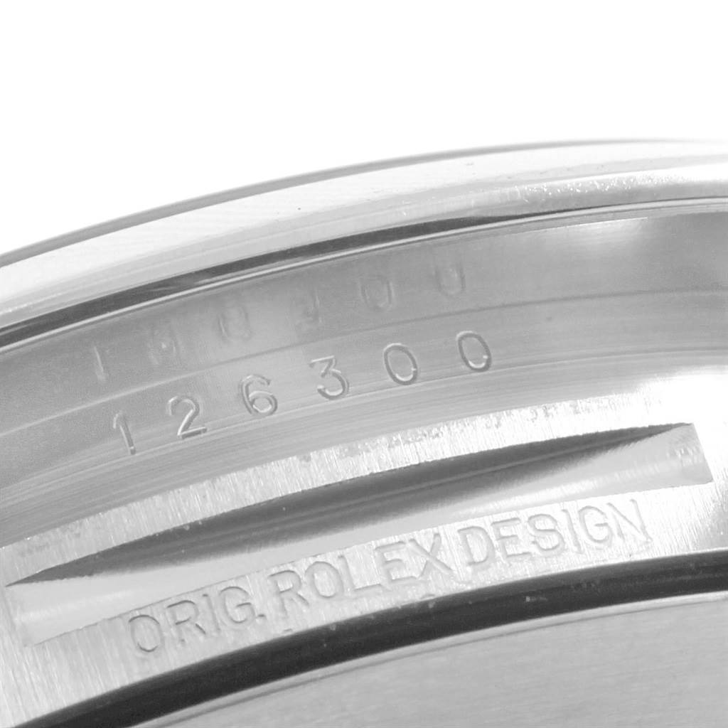 The image shows a close-up of the inner bezel with the engraved serial number and "Orig. Rolex Design" on the Rolex Datejust 41 126300 Men's Stainless Steel Blue Dial 126300 Men's Stainless Steel Blue Dial model.