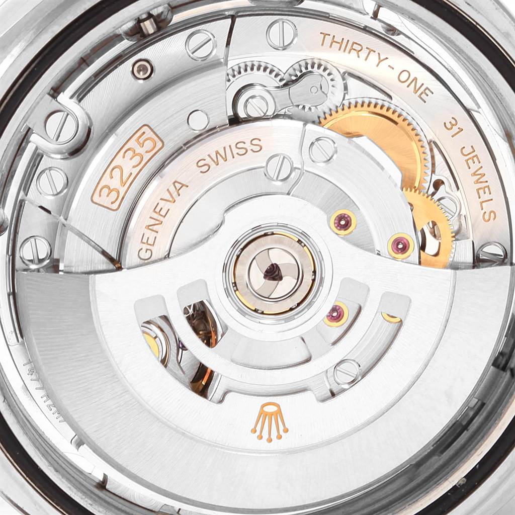 This image shows the movement mechanism of the Rolex Datejust 41 126300 Men's Stainless Steel Silver Dial 126300 Men's Stainless Steel Silver Dial watch, highlighting the intricate gears and jewels.