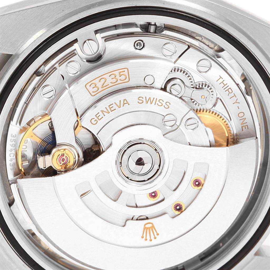 The image shows an internal view of the Rolex Datejust 41 126334 Men's Stainless Steel White Dial 126334 Men's Stainless Steel White Dial's movement, highlighting gears, rotors, and engravings.