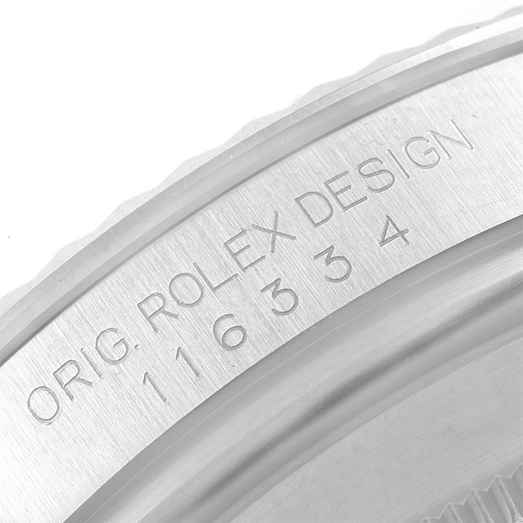The image shows a close-up of the engraved inner bezel of the Rolex Datejust 41 116334 Men's Stainless Steel Silver Dial 116334 Men's Stainless Steel Silver Dial watch, detailing the model number and design reference.