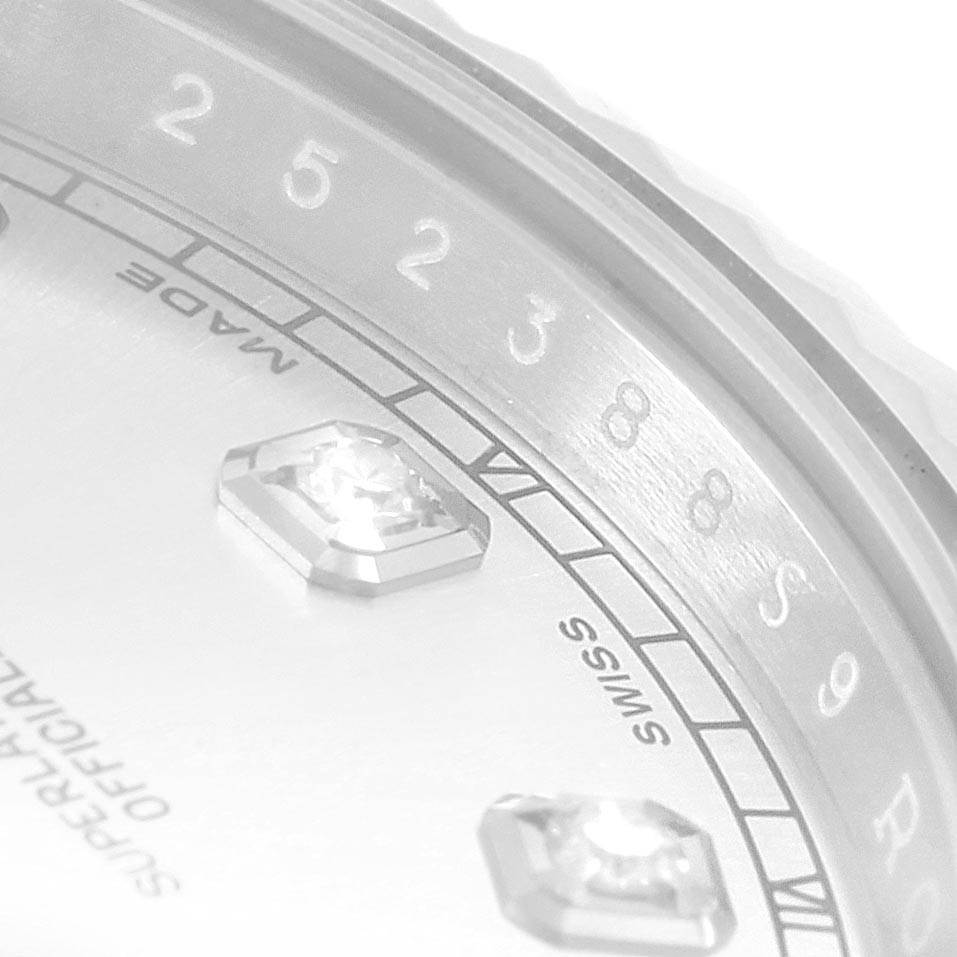 This close-up image of the Rolex Datejust 41 116334 Men's Stainless Steel Silver Dial 116334 Men's Stainless Steel Silver Dial shows the edge of the dial with diamond hour markers and partial text.