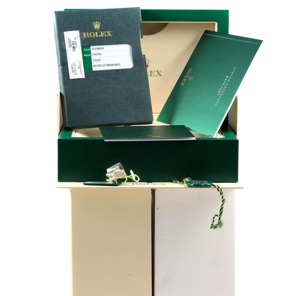 The image shows the packaging and documentation for the Rolex Datejust 41 116334 Men's Stainless Steel Silver Dial 116334 Men's Stainless Steel Silver Dial watch, including manuals and tags.