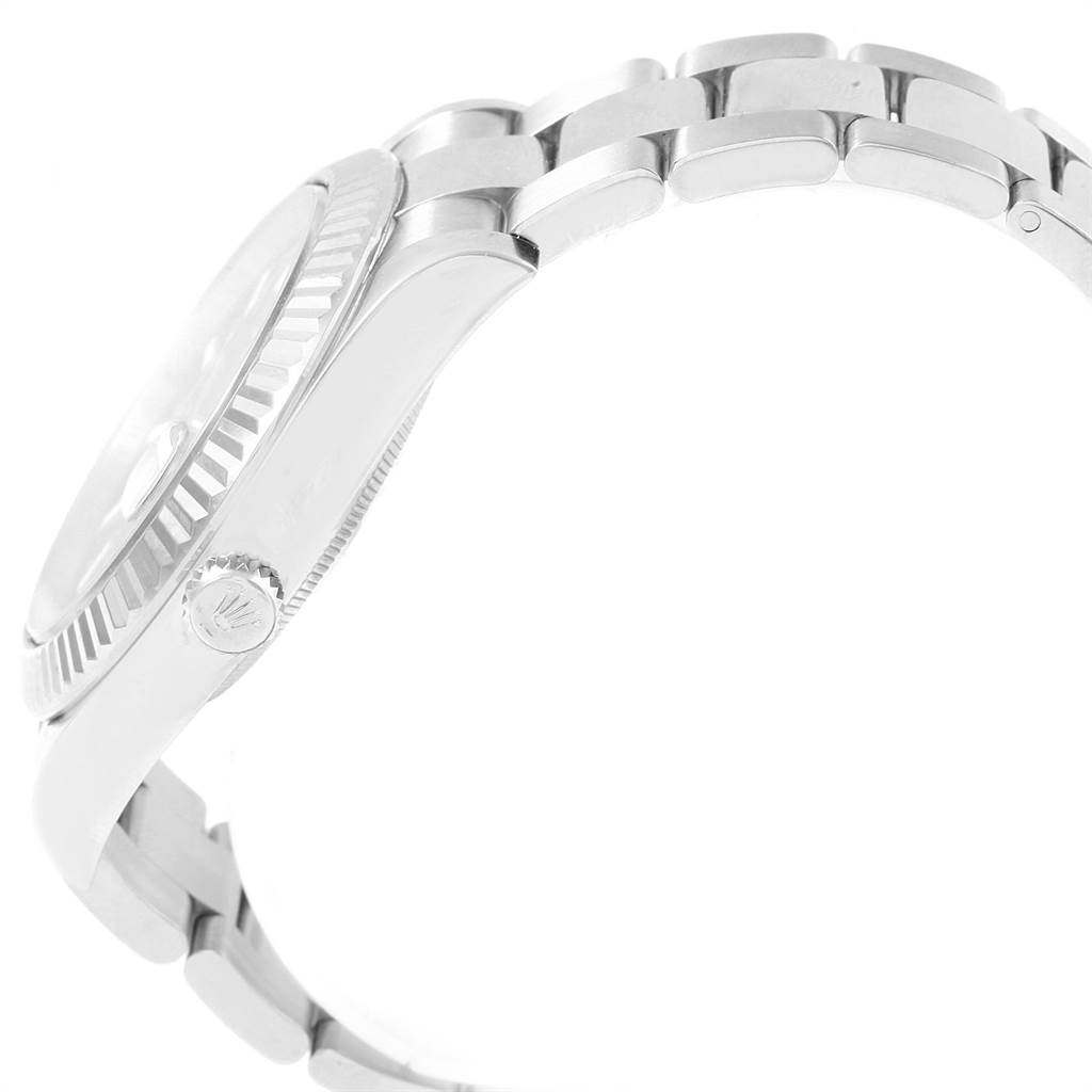 The image shows a side view of the Rolex Datejust 41 116334 Men's Stainless Steel Blue Dial 116334 Men's Stainless Steel Blue Dial watch, highlighting its fluted bezel and bracelet.