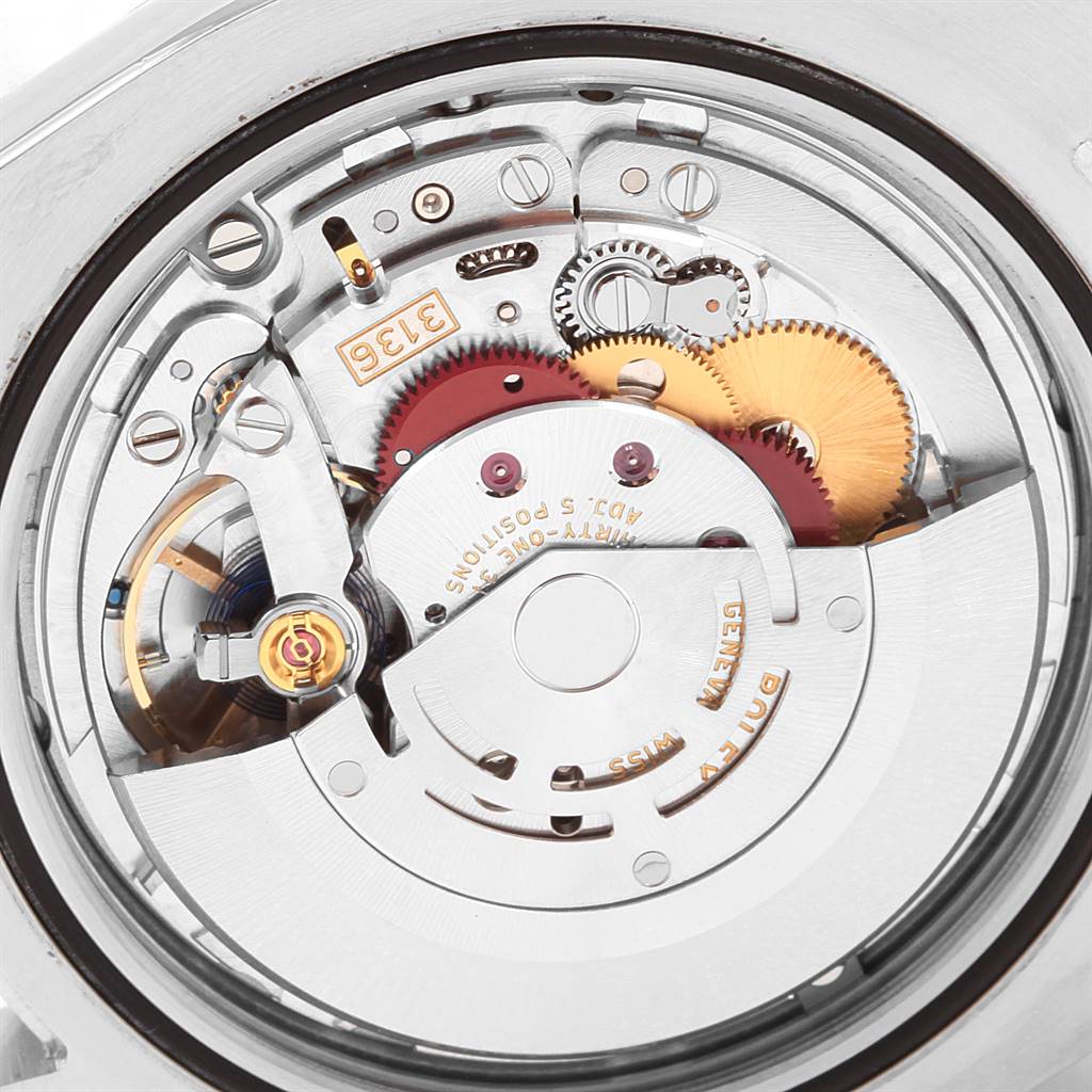 The image shows the intricate internal mechanism and rotor of a Rolex Datejust 41 116300 Men's Stainless Steel White Dial 116300 Men's Stainless Steel White Dial watch's movement from a rear angle.