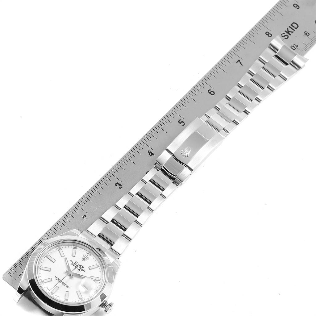 The image shows a Rolex Datejust 41 116300 Men's Stainless Steel White Dial 116300 Men's Stainless Steel White Dial watch, focusing on its face, bracelet, and clasp alongside a ruler for scale.