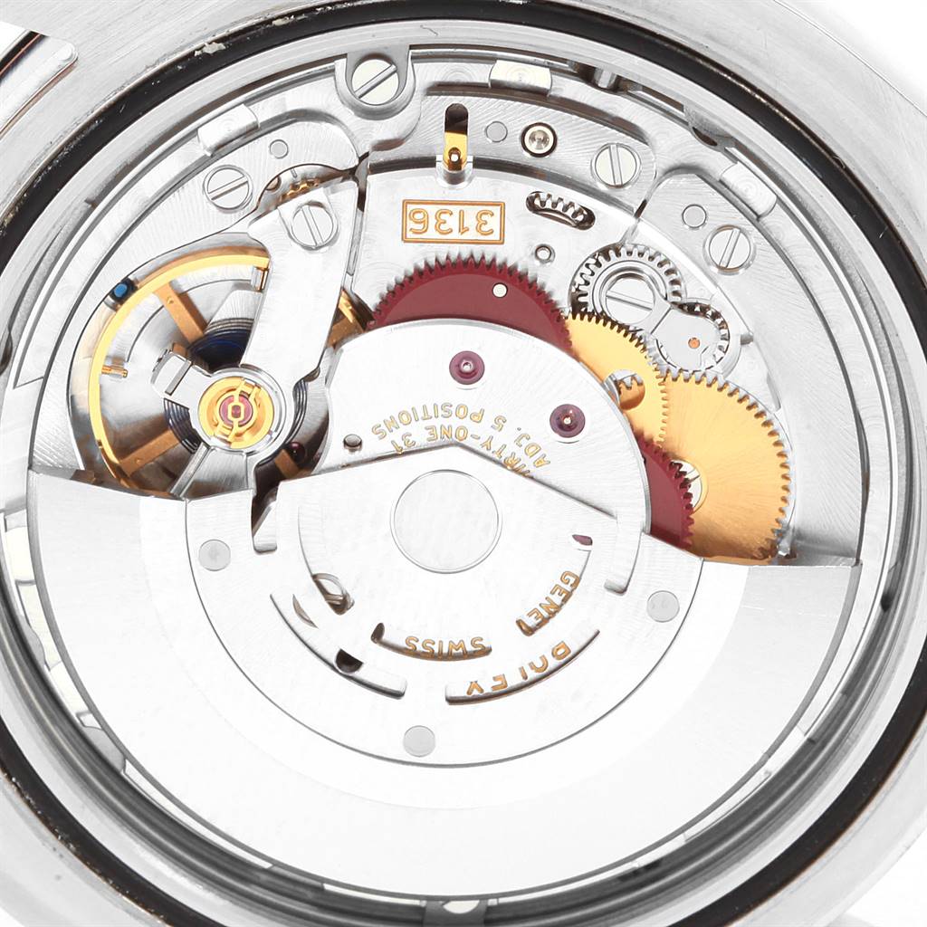 This is a close-up view of the internal mechanism of the Rolex Datejust 41 116300 Men's Stainless Steel White Dial 116300 Men's Stainless Steel White Dial watch, showcasing intricate gears and components.