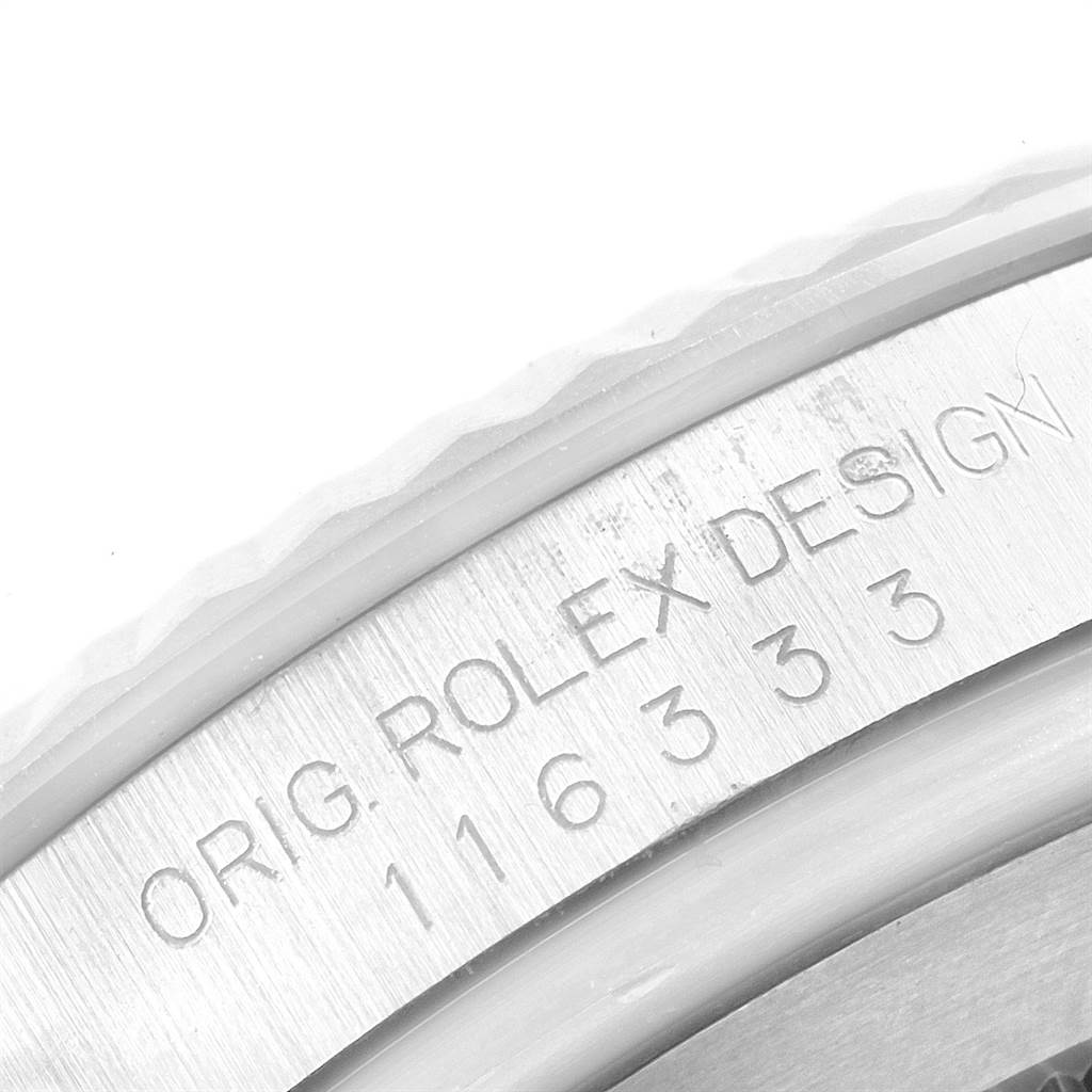 This is a close-up angle showing the engraved details on the case of the Rolex Datejust 41 116333 Men's Steel and Gold (two tone) Black Dial 116333 Men's Steel and Gold (two tone) Black Dial model.