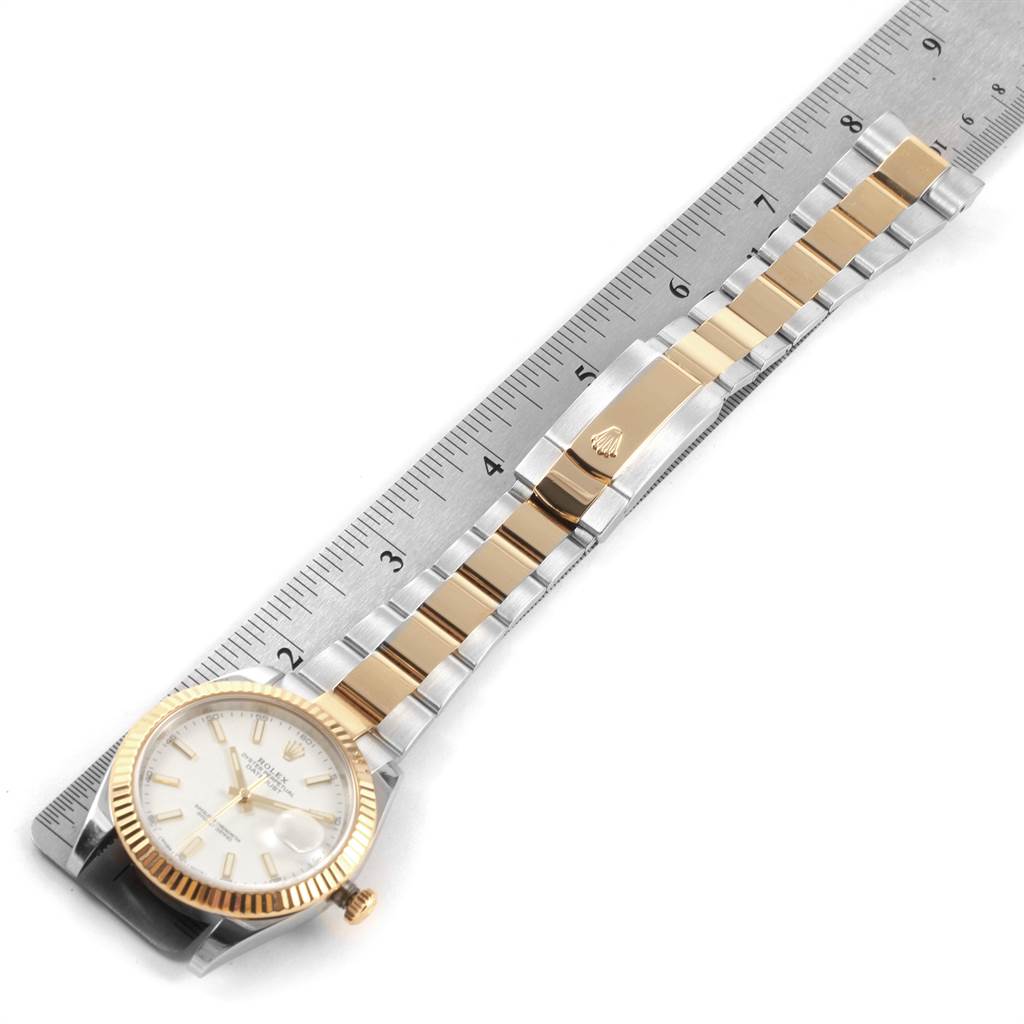 The image shows the Rolex Datejust 41 126333 Men's Steel and Gold (two tone) White Dial 126333 Men's Steel and Gold (two tone) White Dial watch laid out flat, displaying the face, bezel, and bracelet with a ruler for scale.