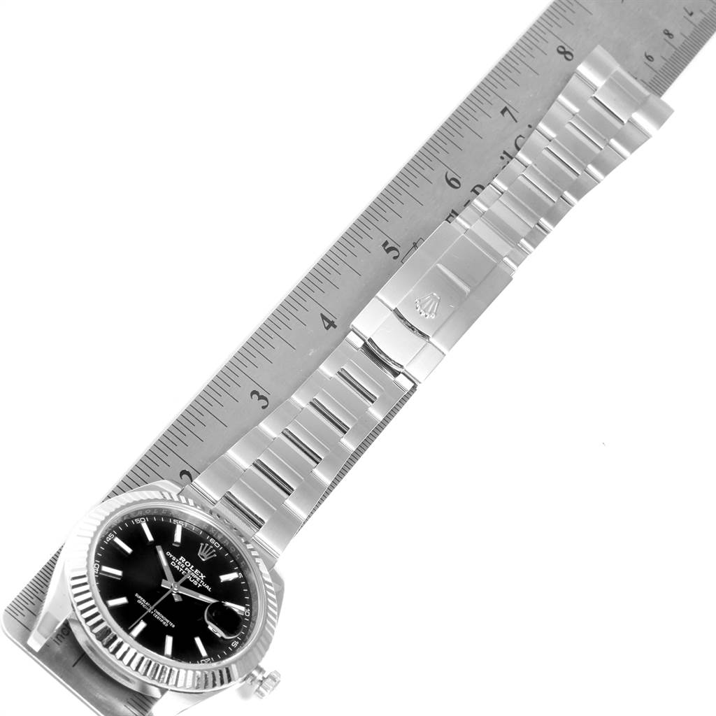 The image shows a Rolex Datejust 41 126334 Men's Stainless Steel Grey Dial 126334 Men's Stainless Steel Grey Dial watch viewed from above, displaying the face, bracelet, and clasp alongside a ruler for scale.