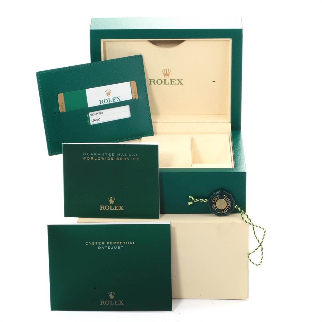 This image shows the official box, guarantee manual, wallet, and tag for the Rolex Datejust 41 126300 Men's Stainless Steel Grey Dial 126300 Men's Stainless Steel Grey Dial.
