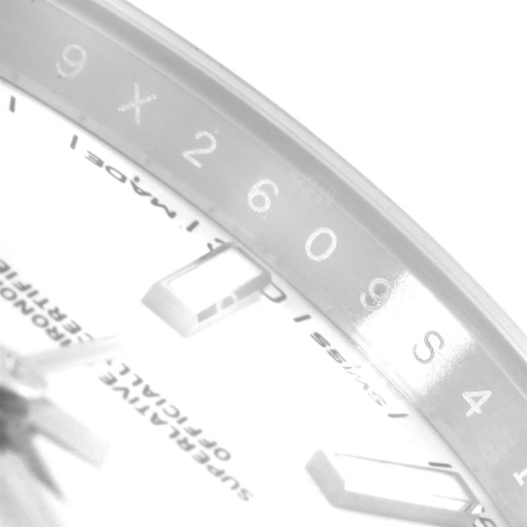 The image shows a close-up of the dial and rehaut of the Rolex Datejust 41 126300 Men's Stainless Steel White Dial 126300 Men's Stainless Steel White Dial, with parts of the hour markers and inscriptions visible.