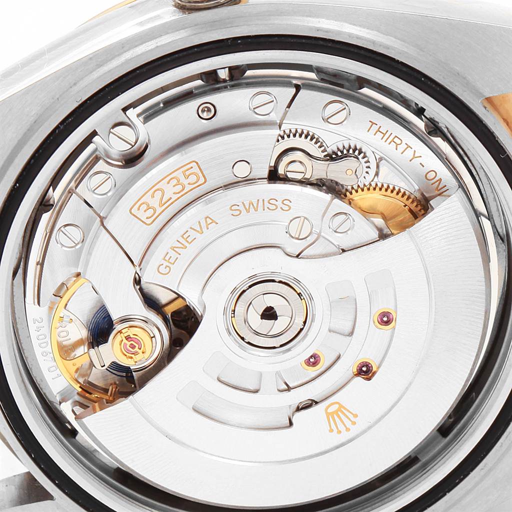 This image shows a close-up of the movement mechanism of a Rolex Datejust 41 126303 Men's Steel and Gold (two tone) Grey Dial 126303 Men's Steel and Gold (two tone) Grey Dial watch model 3235.