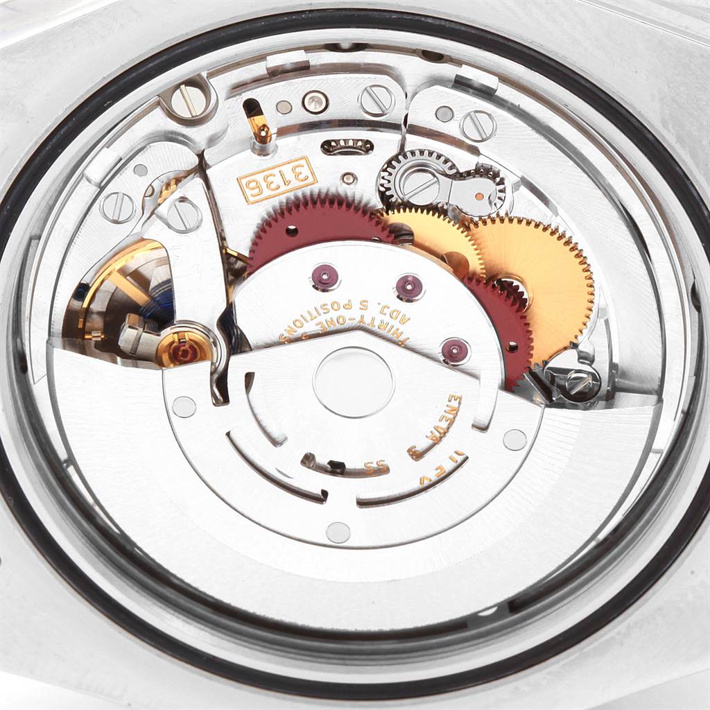 This image displays the intricate inner mechanism of the Rolex Datejust 41 116334 Men's Stainless Steel Black Dial 116334 Men's Stainless Steel Black Dial model from a back angle, highlighting its gears and components.