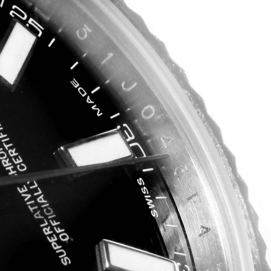 This close-up image of the Rolex Datejust 41 116334 Men's Stainless Steel Black Dial 116334 Men's Stainless Steel Black Dial displays the edge of the dial, showing part of the indices and text details.