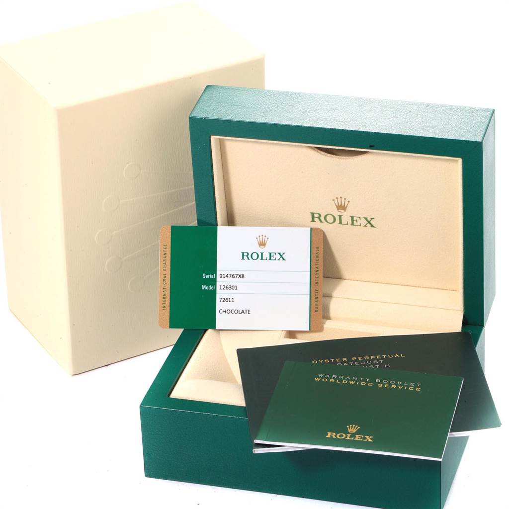 The image shows the packaging, warranty card, and booklets for the Rolex Datejust 41 126301 Men
s Steel and Gold (two tone) Brown Dial 126301 Men
s Steel and Gold (two tone) Brown Dial model.