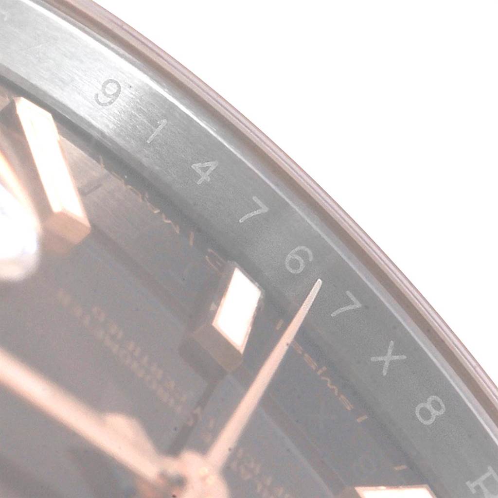 The image shows a close-up of the dial and the inner bezel with numbers on a Rolex Datejust 41 126301 Men
s Steel and Gold (two tone) Brown Dial 126301 Men
s Steel and Gold (two tone) Brown Dial model watch.