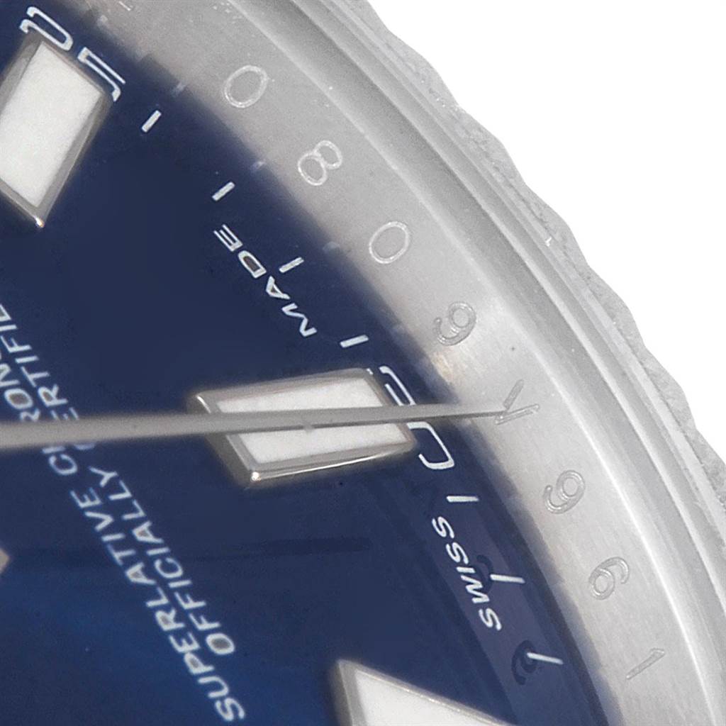 This close-up image shows part of the dial, markers, and the edge of the bezel on a Rolex Datejust 41 116334 Men's Stainless Steel Blue Dial 116334 Men's Stainless Steel Blue Dial watch.