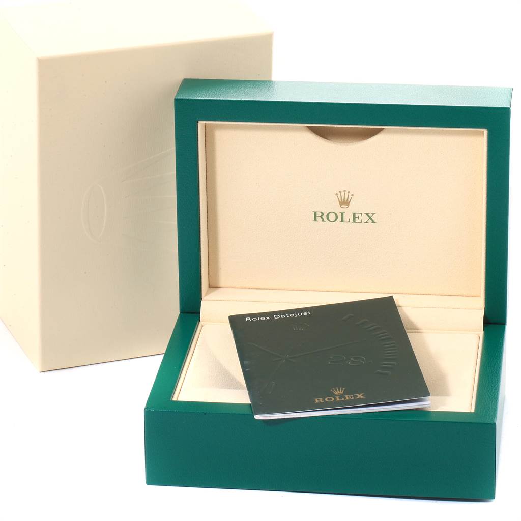 This image shows the open box and the manual for the Rolex Datejust 41 116334 Men's Stainless Steel Blue Dial 116334 Men's Stainless Steel Blue Dial model.