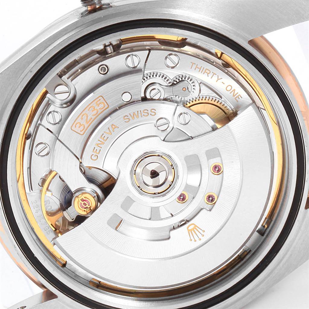 This image shows the movement of the Rolex Datejust 41 126301 Men's Steel and Gold (two tone) Brown Dial 126301 Men's Steel and Gold (two tone) Brown Dial model from the back, highlighting the intricate mechanics and components.