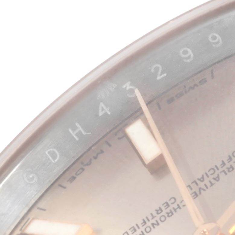 This close-up image shows part of the dial and bezel of a Rolex Datejust 41 126301 Men
s Steel and Gold (two tone) Pink Dial 126301 Men
s Steel and Gold (two tone) Pink Dial watch.
