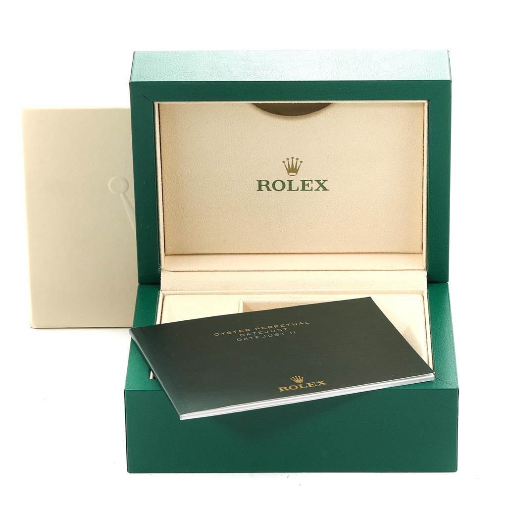 This image shows the open packaging and an instruction booklet for the Rolex Datejust 41 116334 Men's Stainless Steel White Dial 116334 Men's Stainless Steel White Dial watch.
