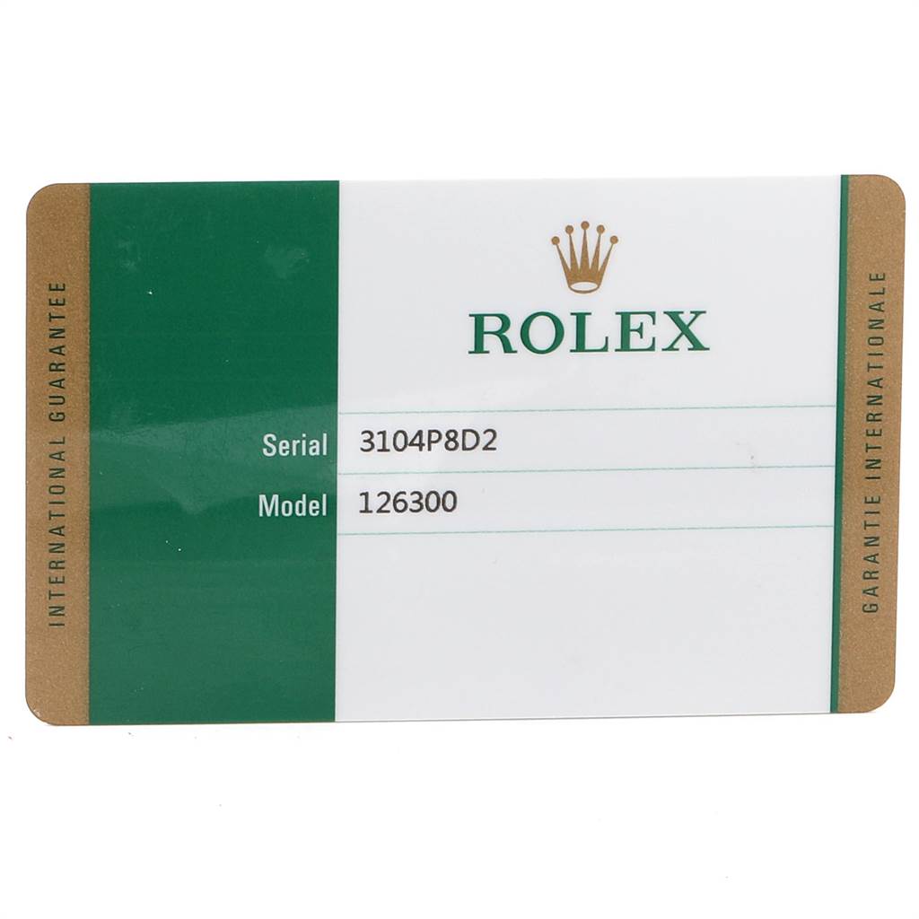 This image shows a Rolex warranty card with the serial number and model number of the Datejust 41 watch.